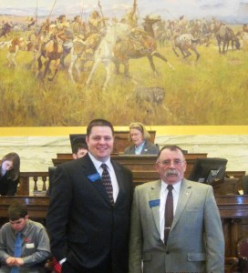 Picture Caption:  Standing in front of the House Rostrum, Representative Duane Ankney on right (HD43) and Representative Jonathan McNiven on left (HD44) who’s House Districts’ currently make up Senator Taylor Brown’s Senate District 22.  