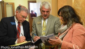 Senator Taylor Brown reviewing the vote tally with East Helena Superintendent  Ron Whitmoyer and East Helena Resident Karen Goldsberry after SB 107 vote yesterday.  