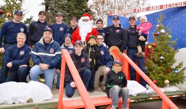 Lockwood Fire Department, family and friends posing with Santa Claus in Lockwood last year in the 2014 Santa tour of Lockwood. 