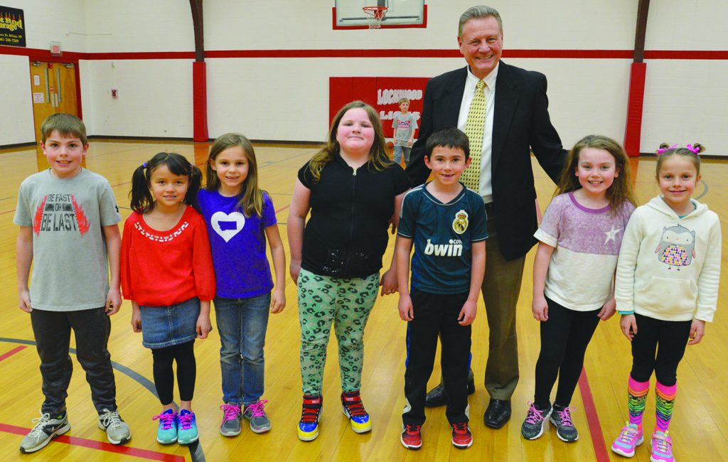 Mike Bowman, longtime principal of Lockwood Elementary School, spent time in PE with second graders on Tuesday. Students in Deb Carlson’s class, they are, from left, Tyler Leinemann, Reese Griesmer, Audrey Rieker, Emerald Browning, Trask Wickens, McKensey Tininenko and Keelee Logan. (Judy Killen photo) 